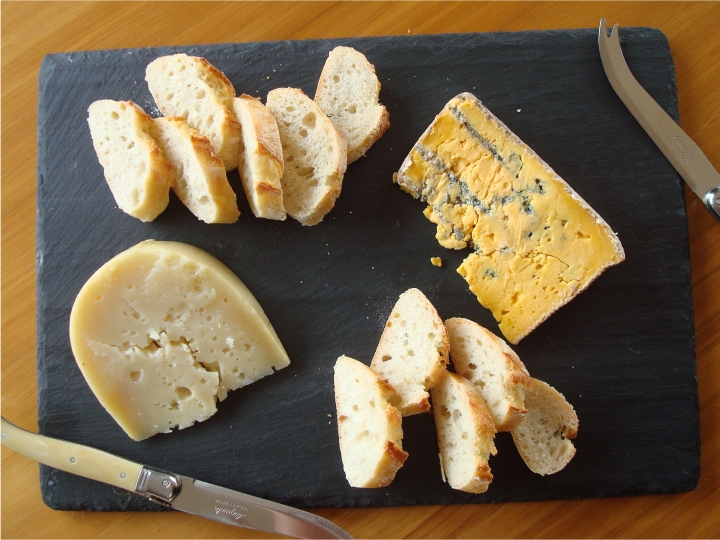 A simple cheeseboard of Cilantro Billy the Kid Goat's Cheddar and Talbot Forest Wiahi Blue.