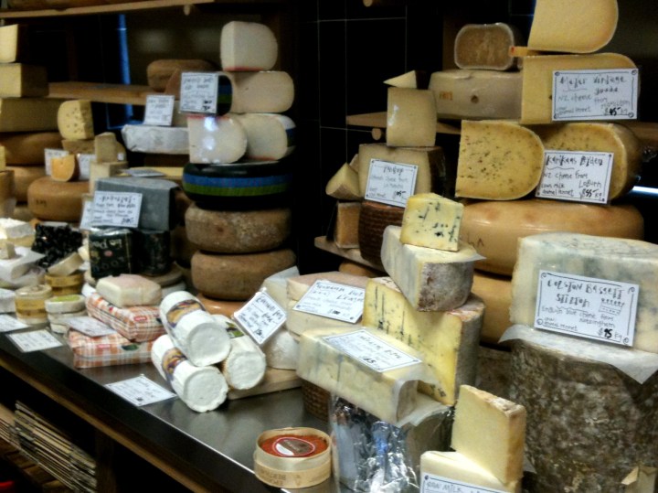 Cheeses sprawl across one wall in their classed in cheese room.